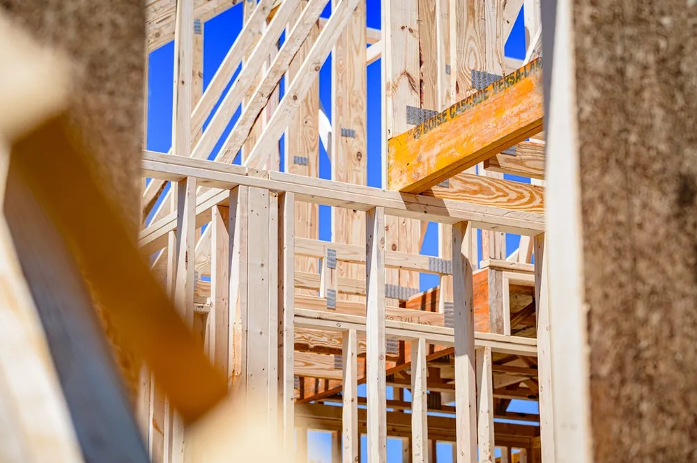 Close view of wood roof and wall framing