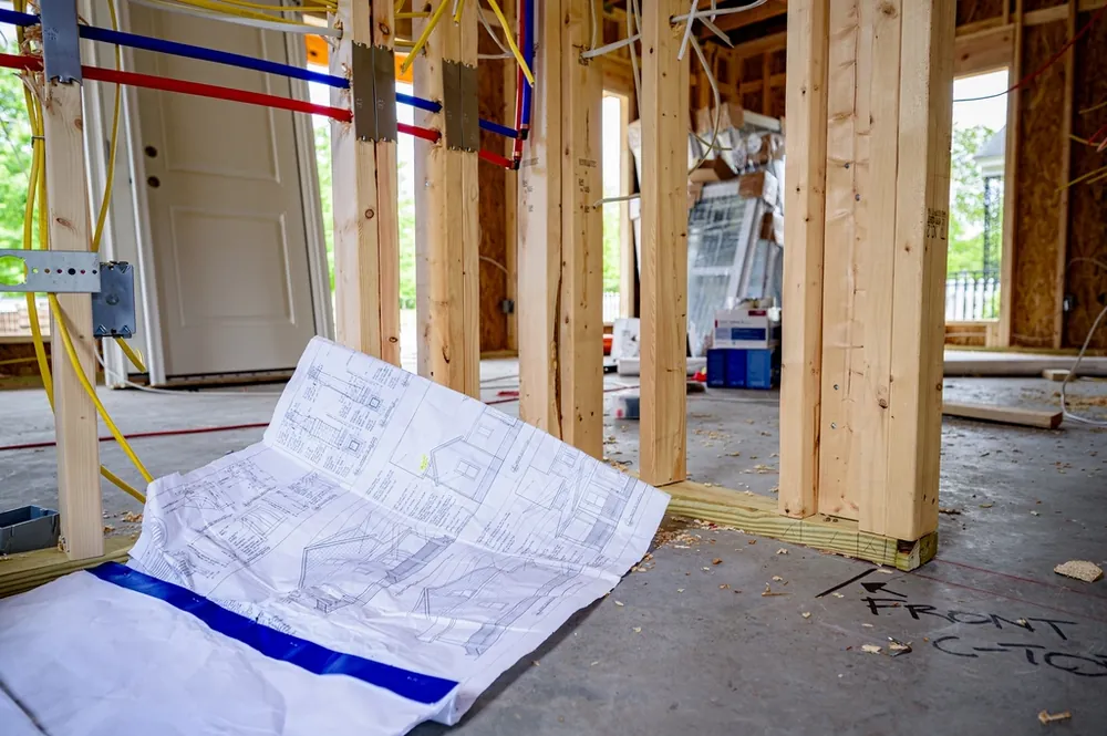 Plans and framing inside a building under construction